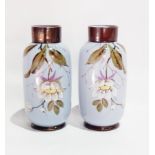 A pair of Edwardian opaline glass vases of shaped straight sided form having purple ground with