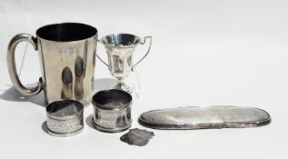 A silver miniature two-handled trophy cup raised on a circular base, London 1868,