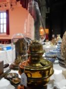 A brass oil lamp and other items