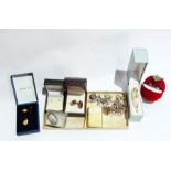 A quantity of costume jewellery to include silver bracelet, brooches, ear clips, pendants, etc.