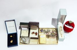 A quantity of costume jewellery to include silver bracelet, brooches, ear clips, pendants, etc.