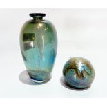 An iridescent glass vase, ovoid bottle form, blue ground with green/gold mottled effect,