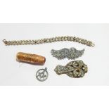A quantity of costume jewellery to include paste brooches, ear clips, pendants, etc.