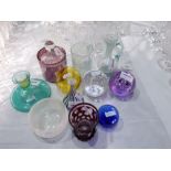 A quantity of decorative glassware to include paperweights, small studio glass bottle necked vase,