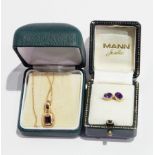 An amethyst and gold pendant with chain together with a pair of amethyst and gold ear studs
