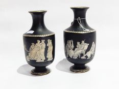Pair vases with waisted neck and circular foot, with classical black and white figure decoration,
