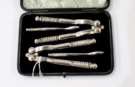 Set of six coffee spoons with coffee bean terminal, two nutcrackers, picks, six teaspoons,