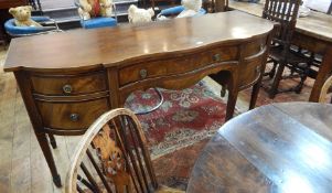 George III style mahogany sideboard, serpentine fronted, with central drawer flanked by cupboard and