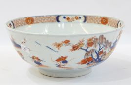 Chinese Imari porcelain bowl painted with figures in rocky landscape with buildings,