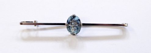 18ct white gold and aquamarine bar brooch having central oval cut aquamarine in raised setting