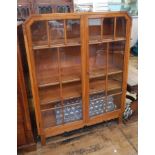 1930's stained oak astragal-glazed bookcase with three shelves, on block tapering supports,