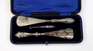 Edwardian silver-handled set comprising pair of shoelifts and button hook,