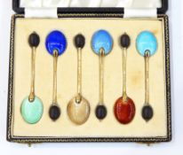 Set of six silver gilt and enamelled coffee bean spoons,