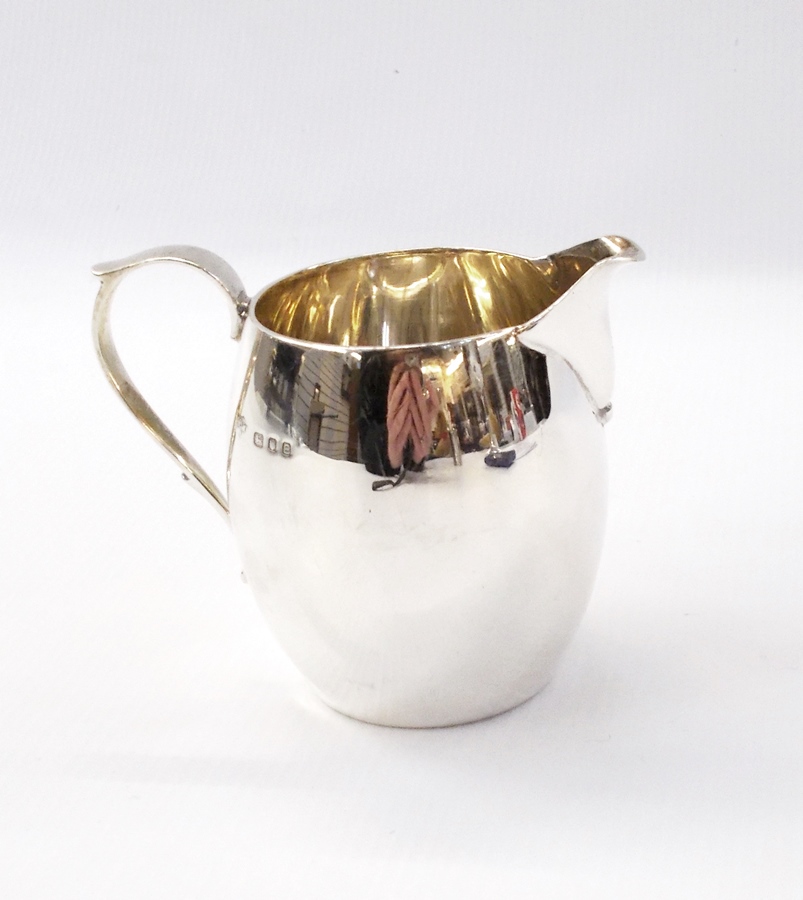 George VI silver barrel-shaped cream jug of plain form, by Mappin & Webb, London 1937, 3oz approx.