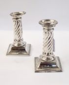 Pair of Victorian silver table candlesticks, spirally wrythen on square beaded bases, London 1886,