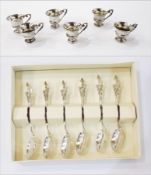 Set of six white metal liqueur cups raised on a circular foot,