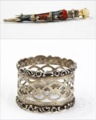 Silver napkin ring, pierced with scroll and floral border,