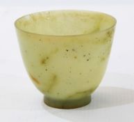 Small Chinese pale celadon jade bowl with flared sides and circular foot, 5.