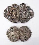 Two pairs of silver plate belt buckles,