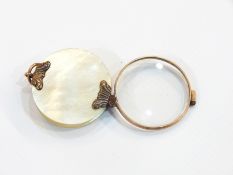 19th century gold-coloured metal and mother-of-pearl folding magnifying glass,