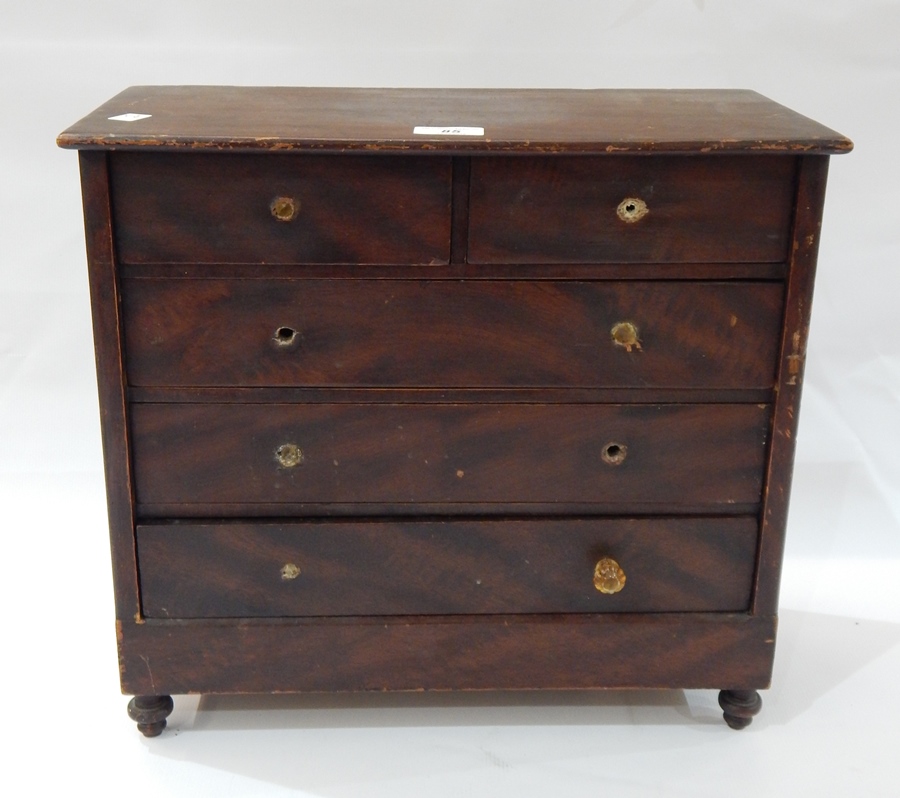 Victorian stained pine miniature chest of four long drawers, on turned wood stump supports, 42.