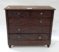 Victorian stained pine miniature chest of four long drawers, on turned wood stump supports, 42.