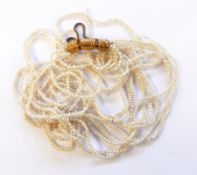 Seedpearl multi-strand necklace with engraved gold-coloured metal hinged barrel-shaped clasp