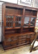 Old Charm "Tudor" reproduction oak sideboard with nest of drawers flanked by pair cupboards and