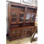 Old Charm "Tudor" reproduction oak sideboard with nest of drawers flanked by pair cupboards and