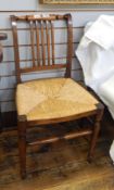 A Victorian hardwood chair, rush seated, railback,