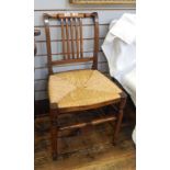 A Victorian hardwood chair, rush seated, railback,
