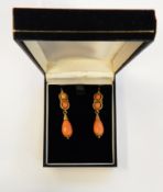 Pair Georgian style gold-coloured metal and coral drop earrings, each with two faceted coral beads,