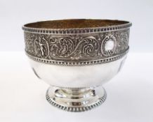 Victorian silver and parcel-gilt small pedestal bowl having scroll and cherub repousse border,