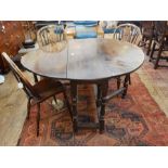 18th century oak oval top gateleg dining table, with a frieze drawer,