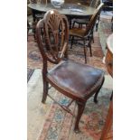 Pair of Hepplewhite style mahogany dining chairs, each with shield shaped back, padded seat,