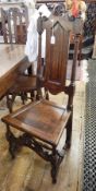Pair 17th century oak high back dining chairs, each with Prince of Wales feather cresting,