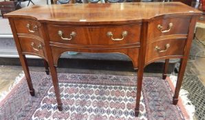 Georgian style serpentine fronted mahogany sideboard with one long and two short drawers,