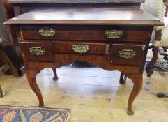 Reproduction 18th century style mahogany lowboy having an arrangement of five drawers,