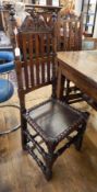 Pair 17th century oak railback dining chairs, each having scroll cresting,