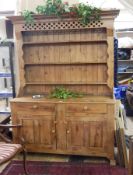 Antique pine dresser, with  shelves, two drawers and two cupboards,