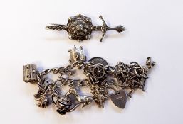 Silver charm bracelet with multiple charms, 1.7oz approx.