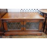 Old Charm "Tudor" low side cabinet enclosed by pair lead light panel doors,