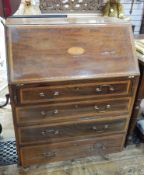 George III style inlaid mahogany bureau, with fan patera, four long drawers below, on castors,