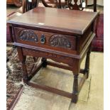 Old Charm "Tudor" side table with lunette carved front and on baluster supports,