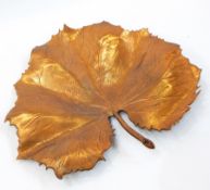 Copper shallow dish in the form of a large leaf,