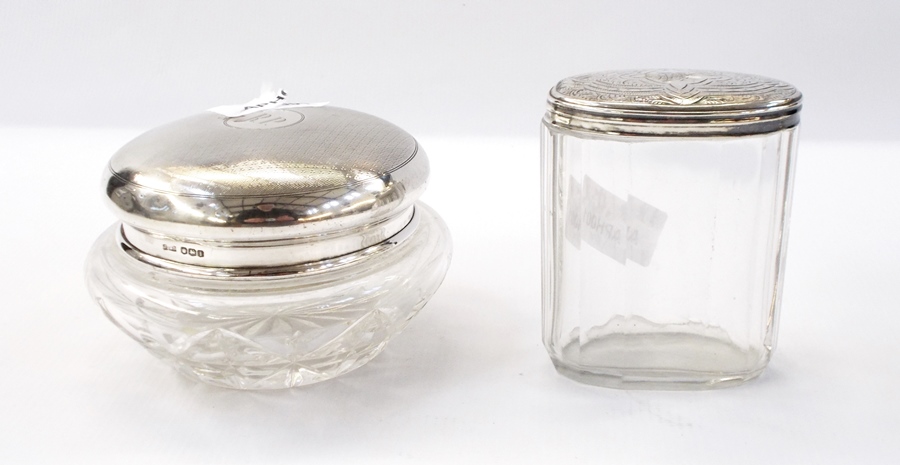 Edwardian silver-topped circular cut glass jar with engine-turned decoration,