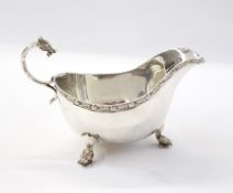 George V silver sauceboat with Celtic reed pattern border,