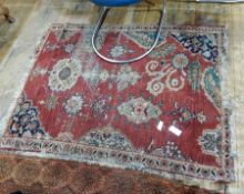 Eastern wool rug with asymmetric design, on red field,