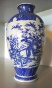 A Chinese ovoid blue and white vase decorated figures in a foliate landscape, 24cm high,