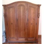 An early 20th century continental oak bedroom suite having egg and dart carved mouldings,